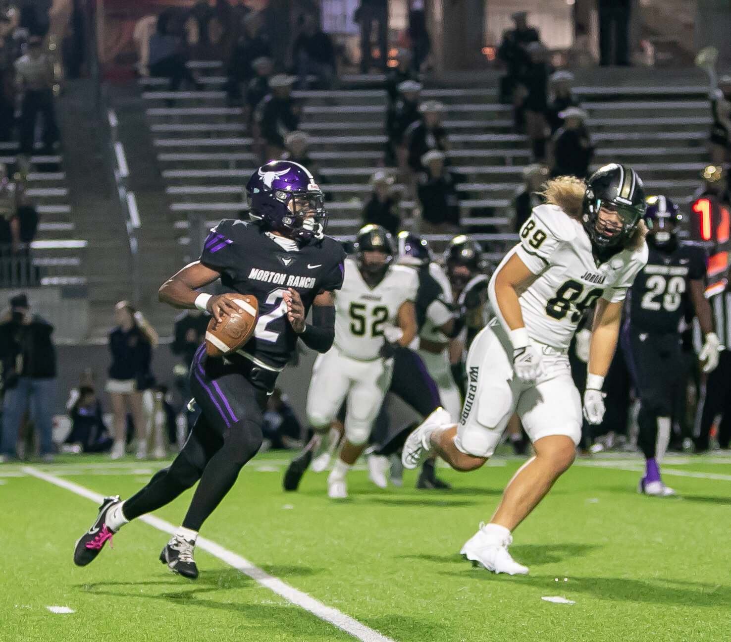 Mike Gerald looks to throw the ball during Thursday's game between Jordan and Morton Ranch at Legacy Stadium.