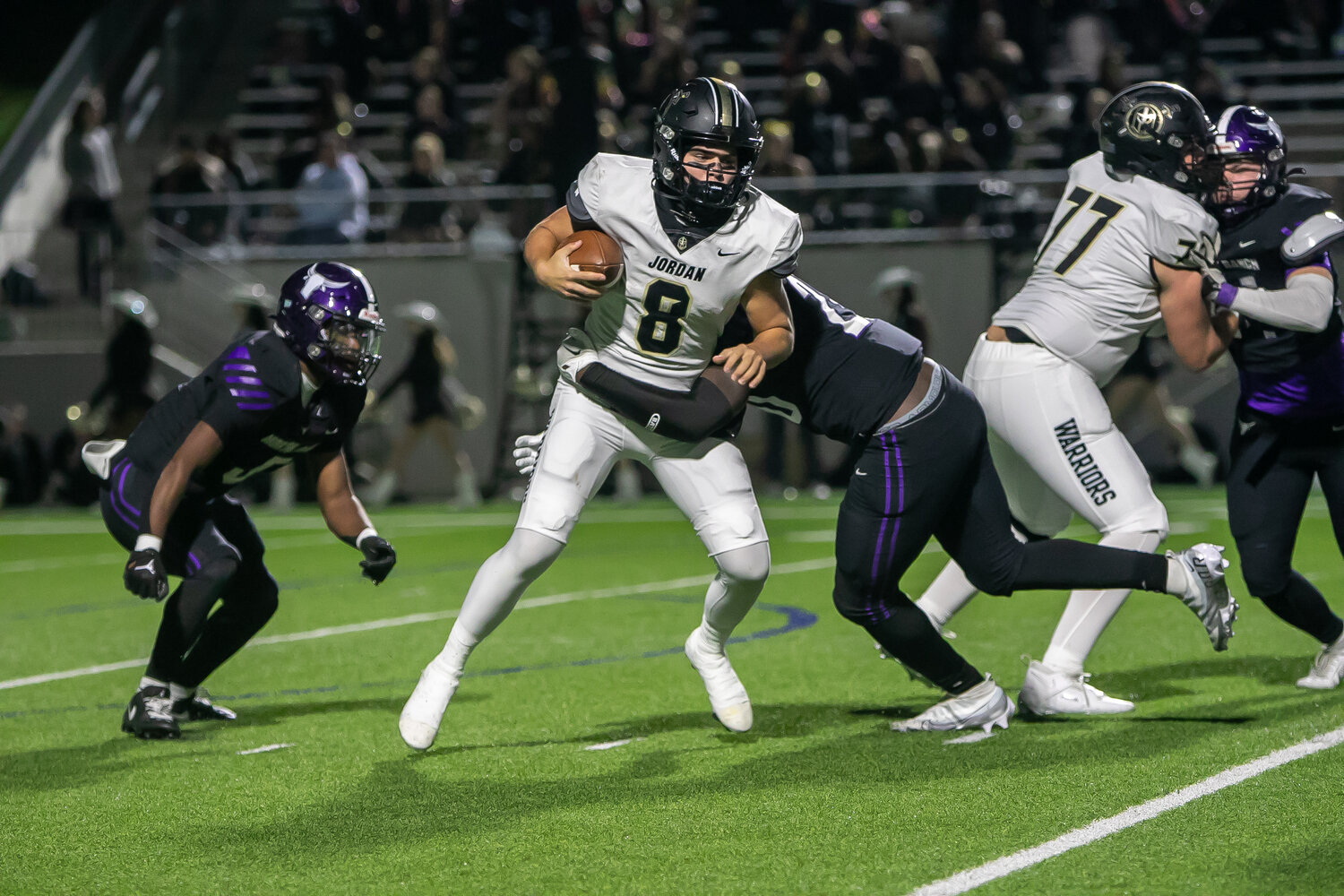 Colin Willetts is brought down for a sack during Thursday's game between Jordan and Morton Ranch at Legacy Stadium.