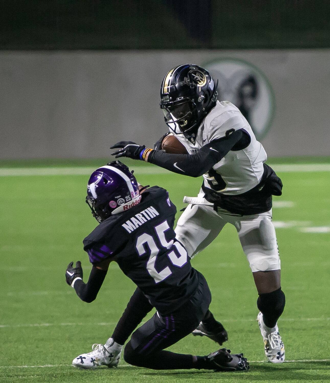 Andrew Marsh stiff arms a defender during Thursday's game between Jordan and Morton Ranch at Legacy Stadium.