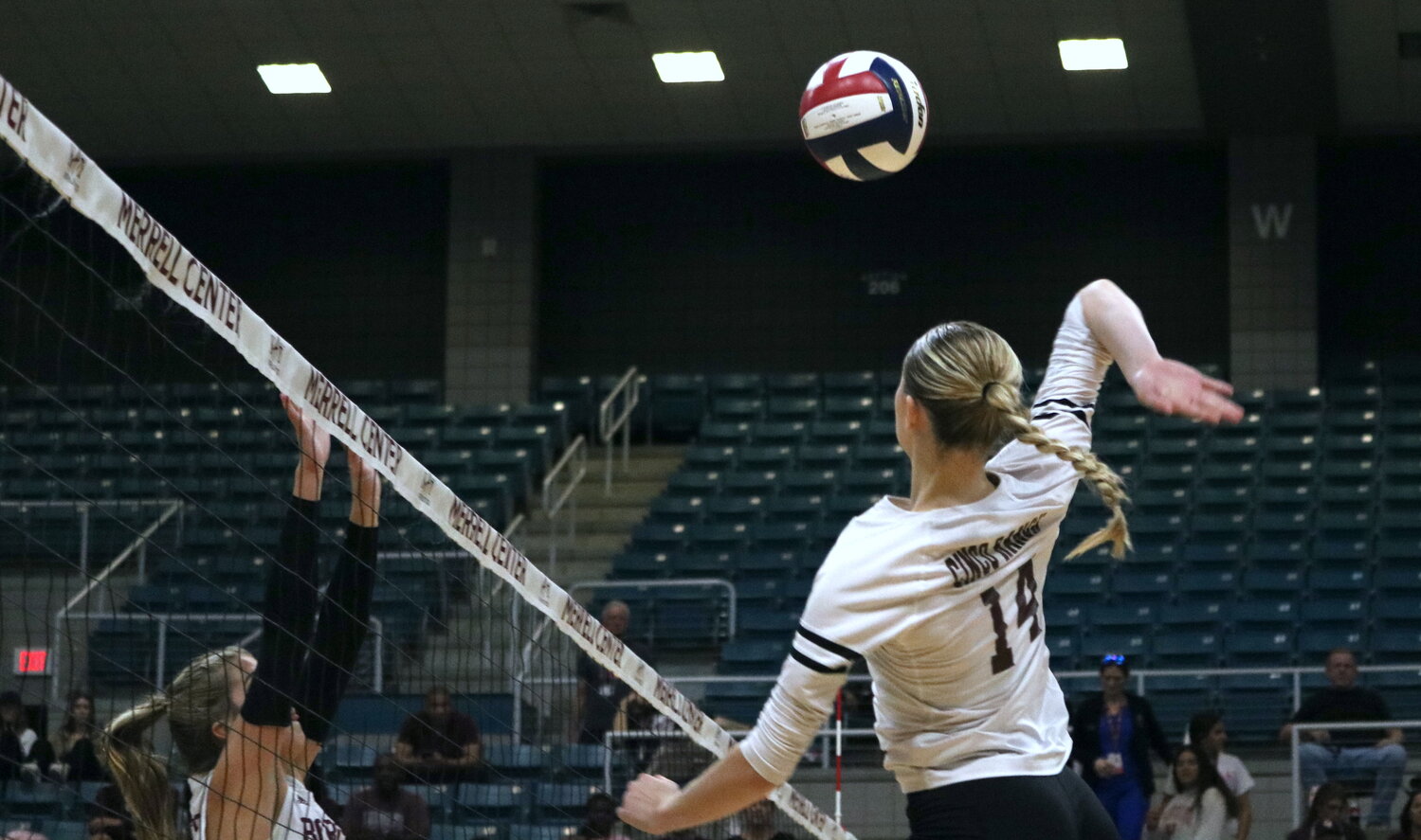 Emily Killam spikes the ball during Tuesday’s match between Cinco Ranch and Cy-Fair at the Merrell Center.
