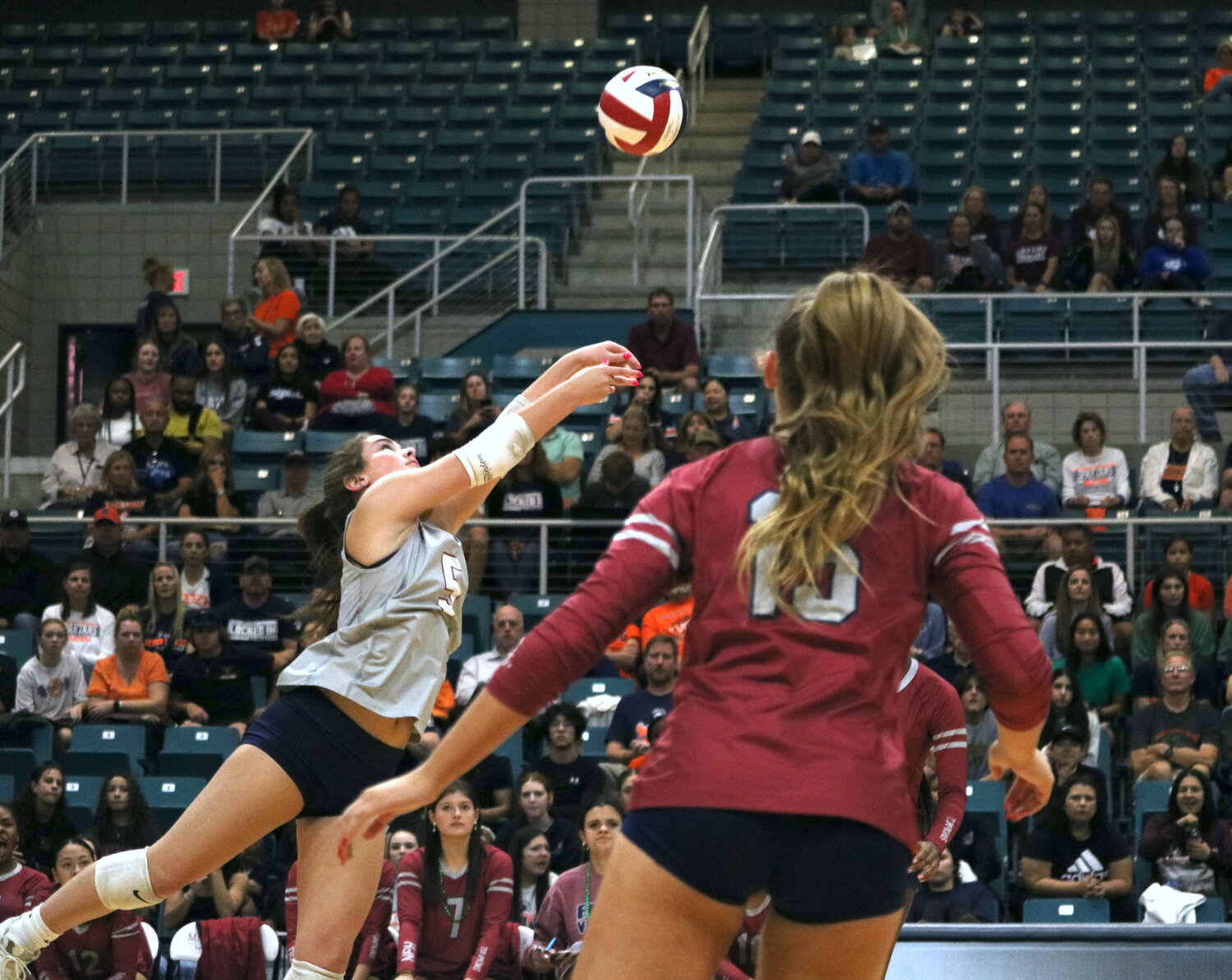 Tompkins’ Brooklynn Merrell digs a ball during Tuesday’s match between Seven Lakes and Tompkins at the Merrell Center.