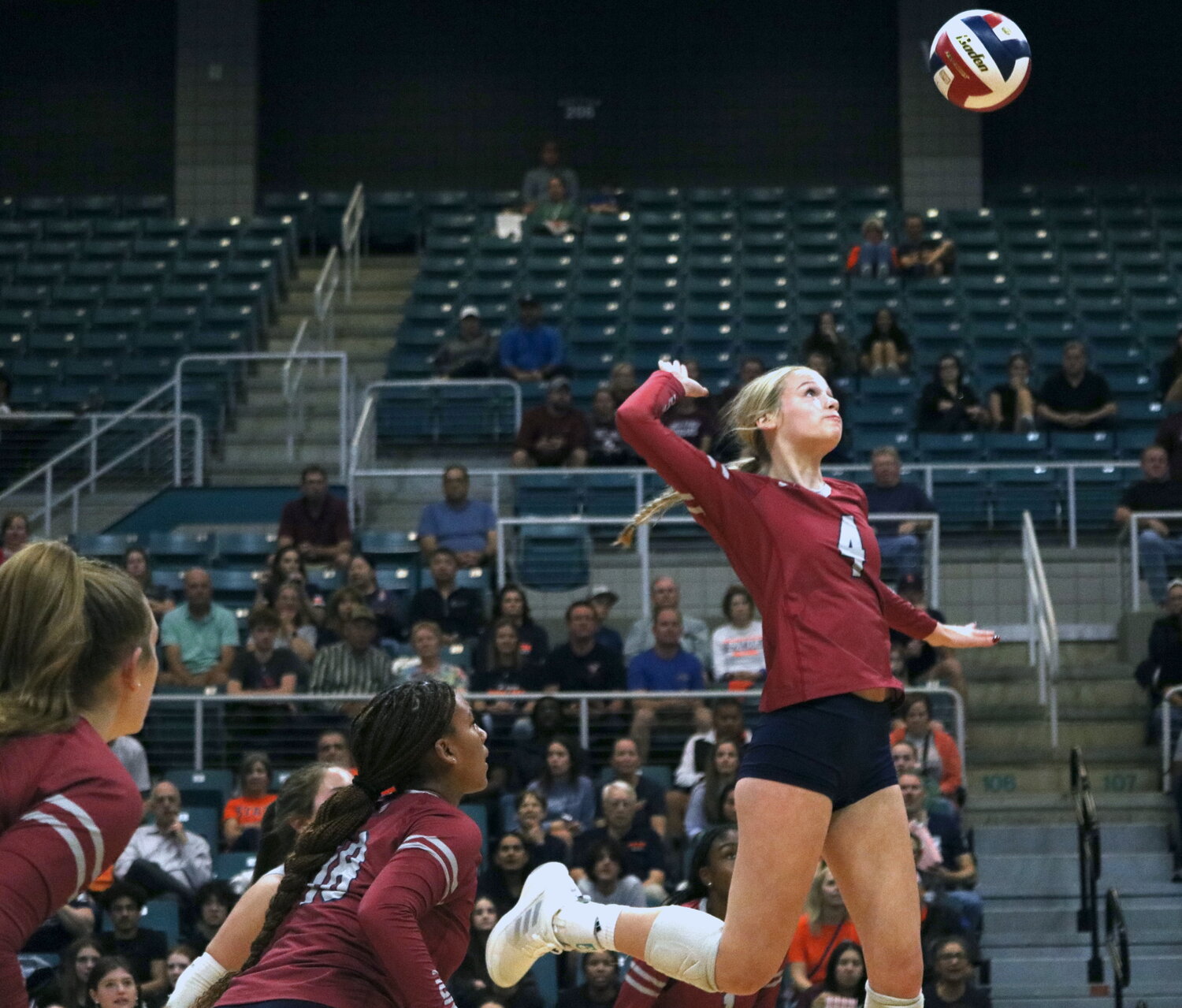 Tompkins’ Callie Funk spikes the ball during Tuesday’s match between Seven Lakes and Tompkins at the Merrell Center.
