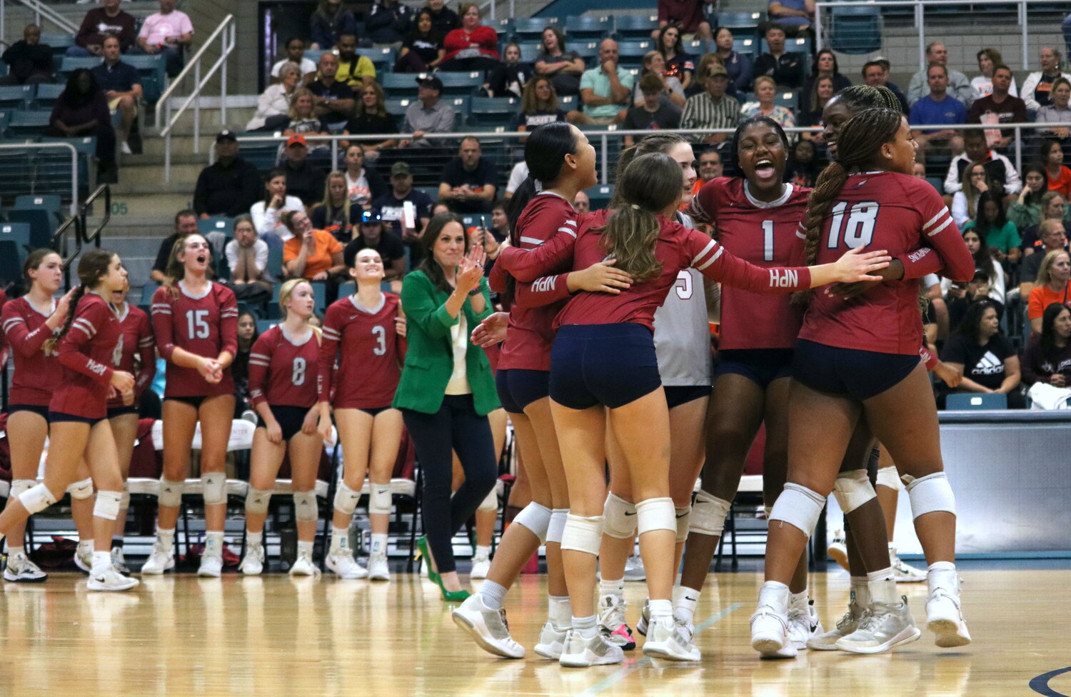 Tompkins players celebrate after winning a set during Tuesday’s match between Seven Lakes and Tompkins at the Merrell Center.