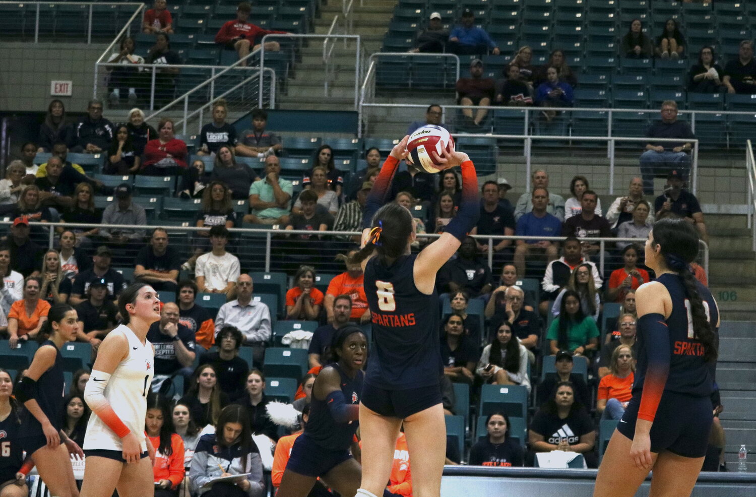 Seven Lakes’ Kate Kuehn sets the ball during Tuesday’s match between Seven Lakes and Tompkins at the Merrell Center.
