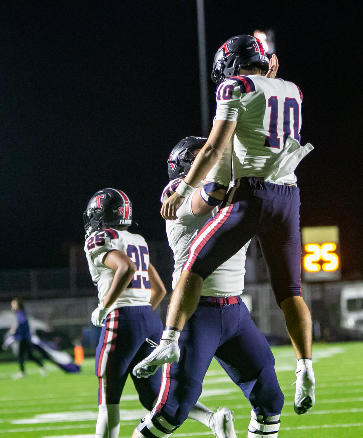 Wyatt Young is lifted up after a touchdown during Friday's game between Tompkins and Ridge Point at Hall Stadium.