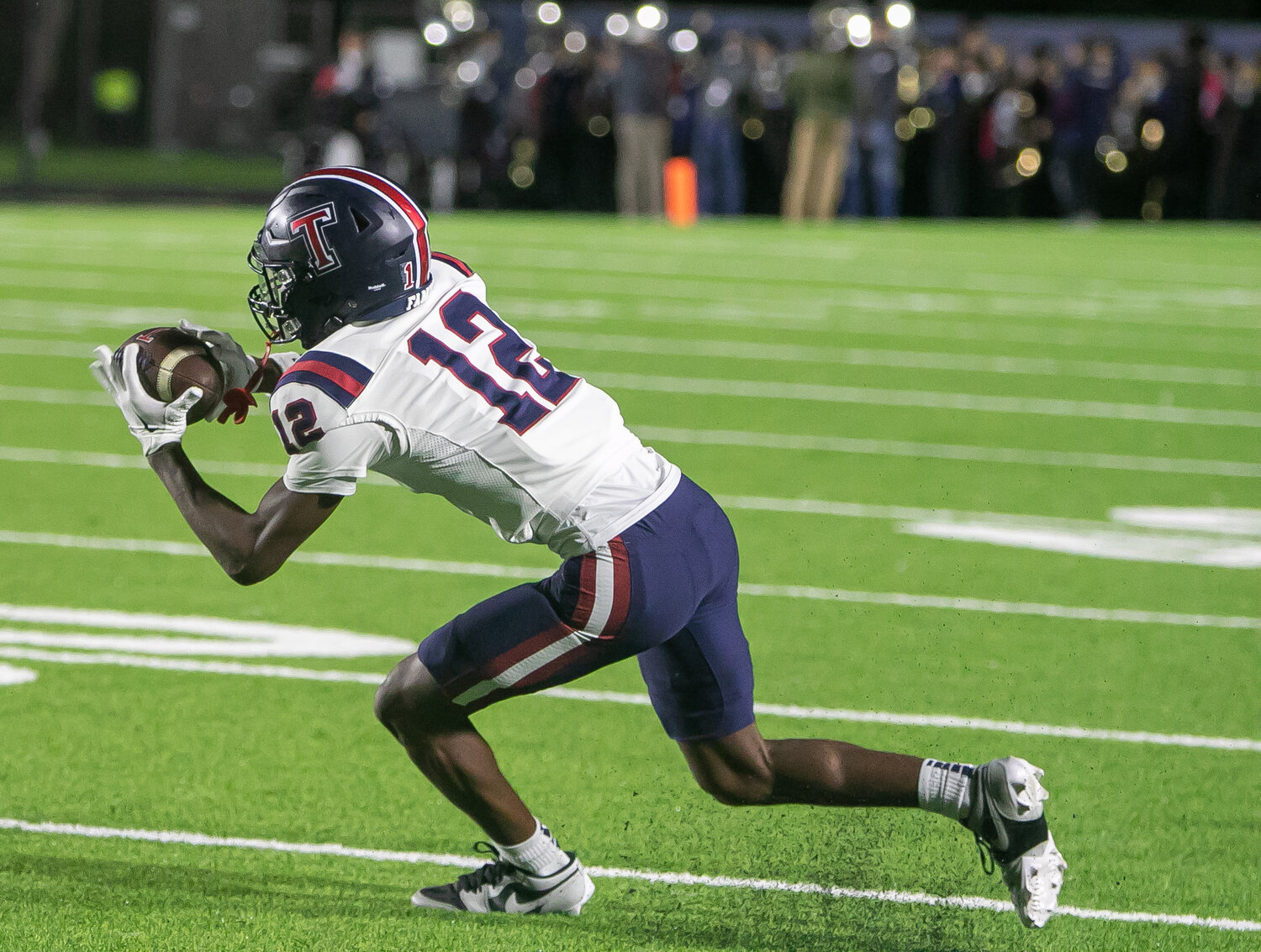 KJ Madison makes a catch during Friday's game between Tompkins and Ridge Point at Hall Stadium.