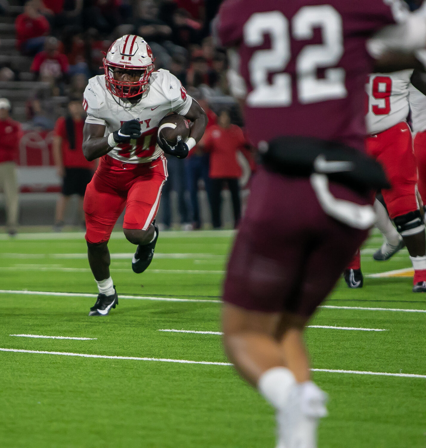 Tremayne Hill runs the ball during Friday's area round game between Katy and Cy-Fair at the Berry Center in Cypress.