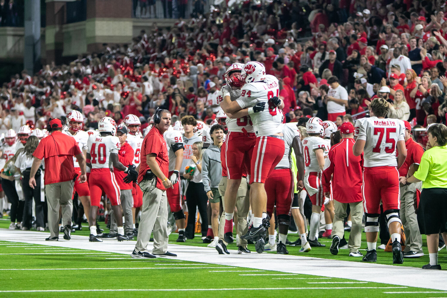 Luke Carter and Colton Sanders celebrate after Carter scored a touchdown during Friday's area round game between Katy and Cy-Fair at the Berry Center in Cypress.