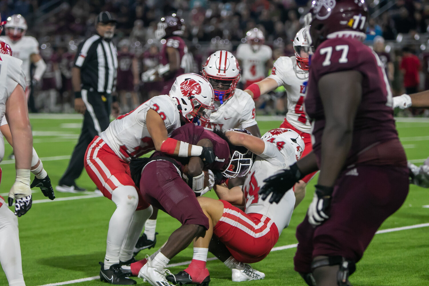 Connor Johnsey brings down a ballcarrier during Friday's area round game between Katy and Cy-Fair at the Berry Center in Cypress.