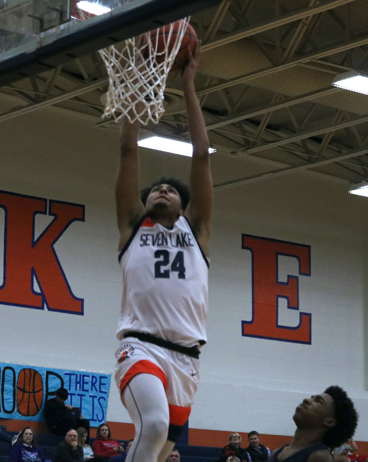 AJ Bates dunks the ball during Monday's game between Seven Lakes and Pearland Dawson at the Seven Lakes gym.