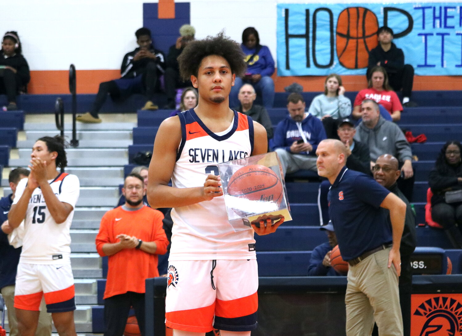 AJ Bates is celebrated as the Seven Lakes career points record holder before Monday's game between Seven Lakes and Pearland Dawson at the Seven Lakes gym.