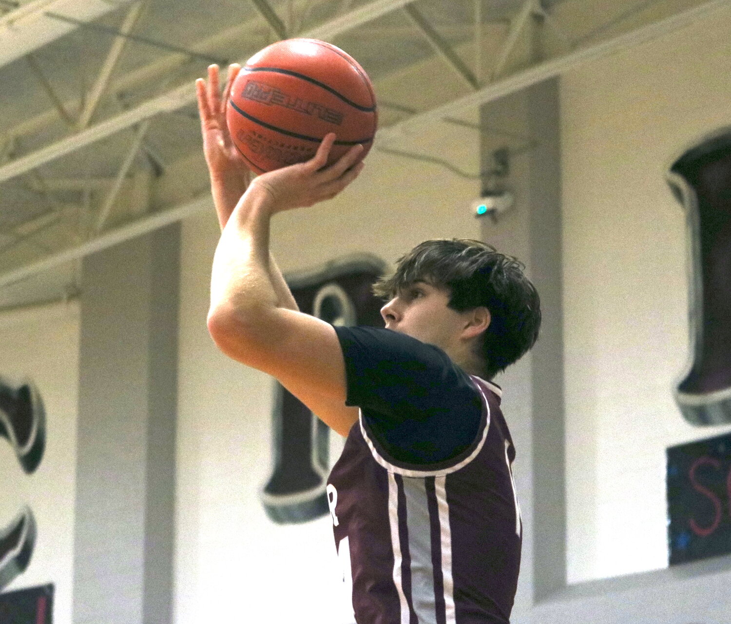 Noah Pearce shoots a 3-pointer during Friday's game between Cinco Ranch and Klein at the Cinco Ranch gym.