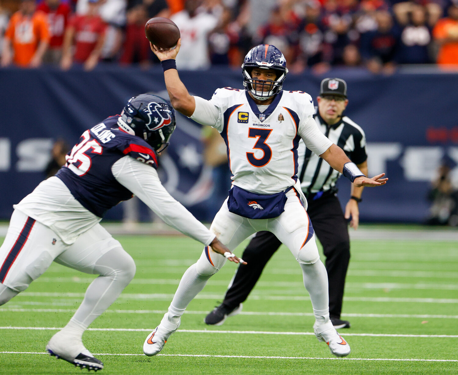 Broncos quarterback Russell Wilson (3) passes the ball during an NFL game between the Texans and the Broncos on December 3, 2023 in Houston. The Texans won, 22-17.