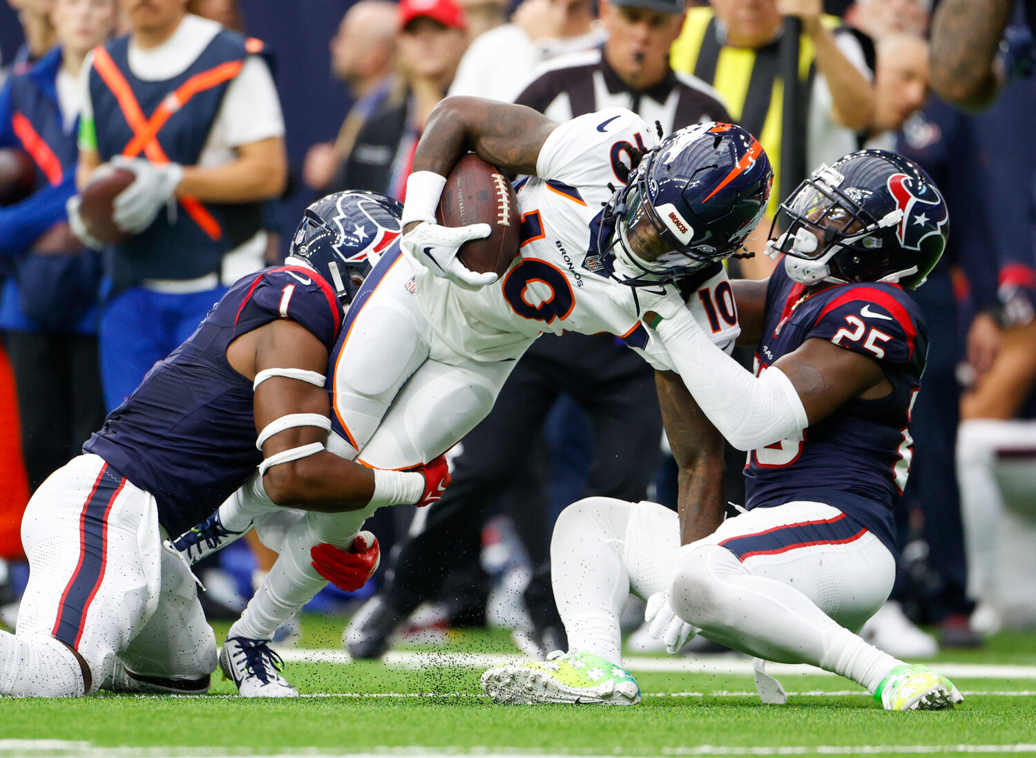 Broncos wide receiver Jerry Jeudy (10) is tackled after a catch during an NFL game between the Texans and the Broncos on December 3, 2023 in Houston. The Texans won, 22-17.