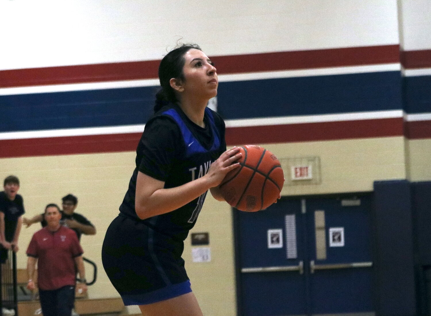 Mia Lopez shoots a 3-pointer during Friday's game between Taylor and Tompkins at the Tompkins gym.