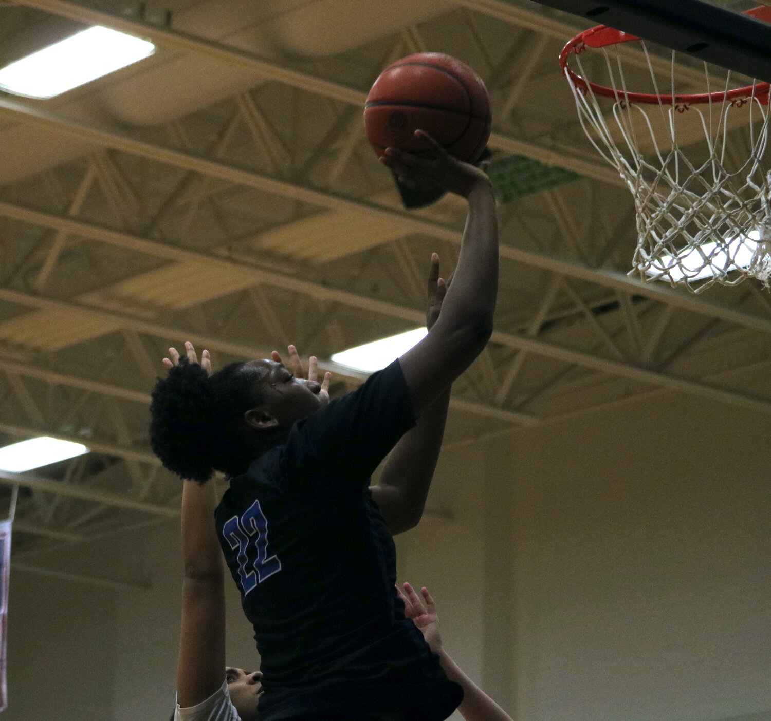 Timya Grice shoots a layup during Friday's game between Taylor and Tompkins at the Tompkins gym.