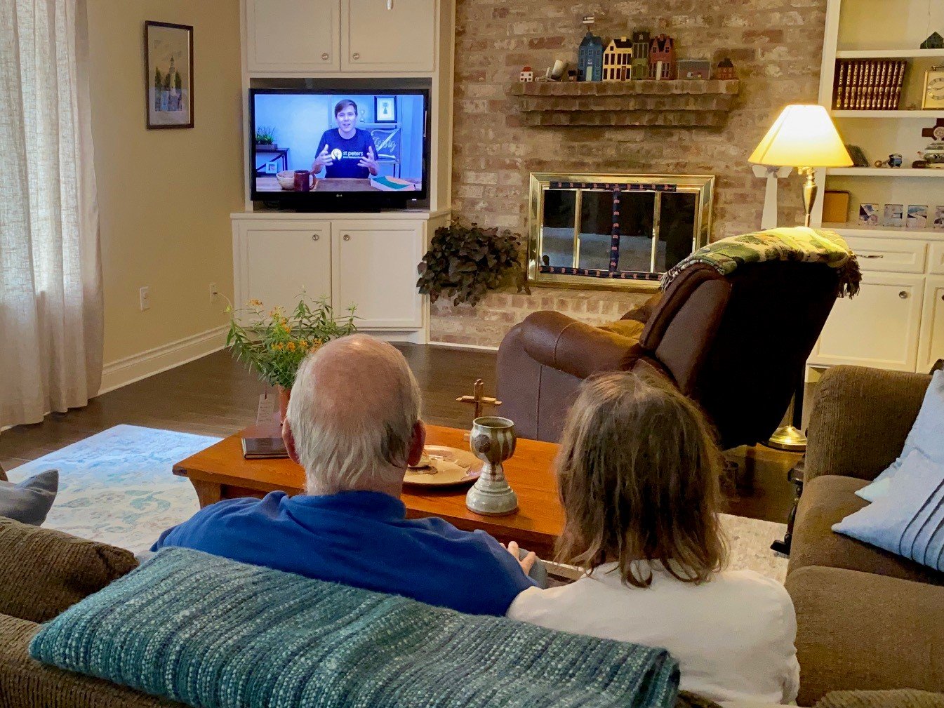 Rev .Bob Johnson and his wife, Susan Johnson watching the St. Peter’s United Methodist Church’s West Campus live-stream services.