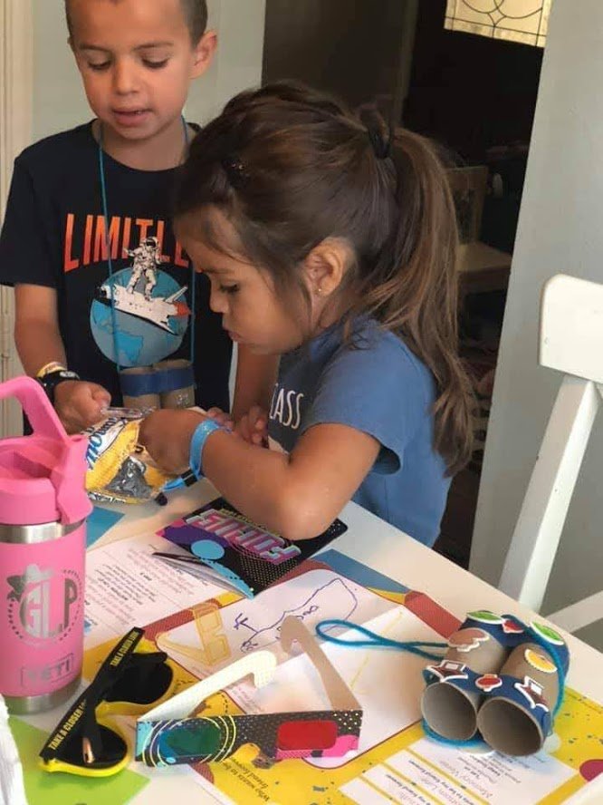 Children working with the materials from St. Peter’s UMC’s Vacation Bible School. Materials were provided to young parishioners to ensure they did not miss the VBS program which provides faith education over the summer months.