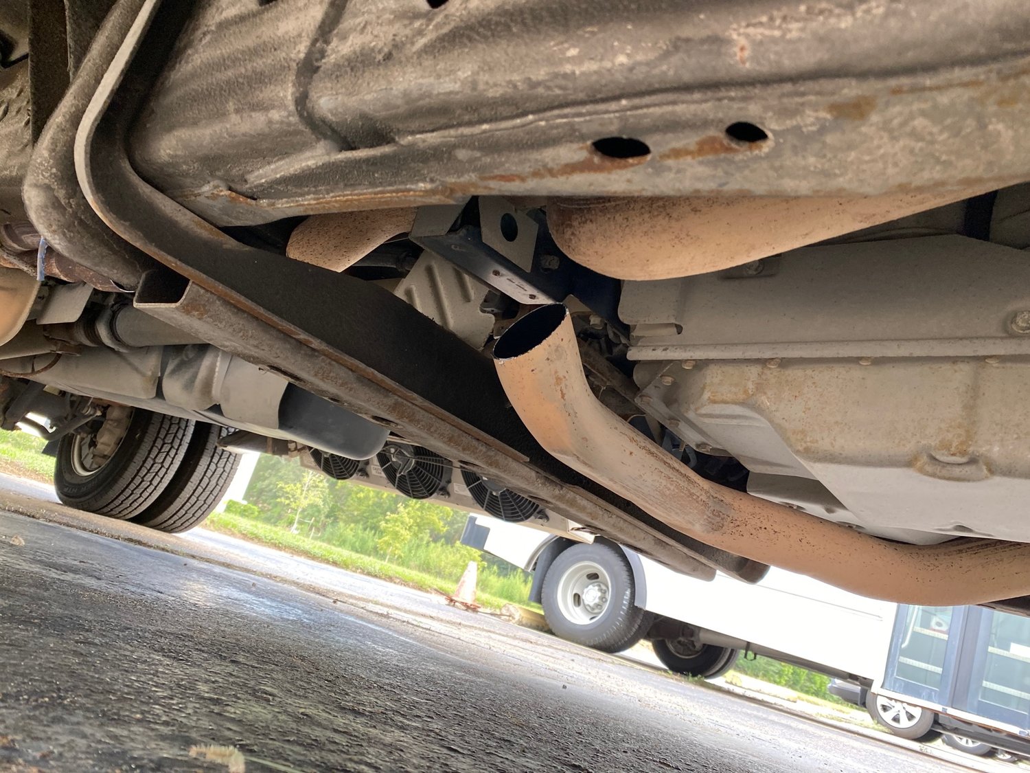 A view underneath the buses shows the space where the catalytic converters should be. The devices, which make engine exhaust less toxic, have various metals in their makeup including platinum, making them valuable items for sales to metal scrap purchasers.