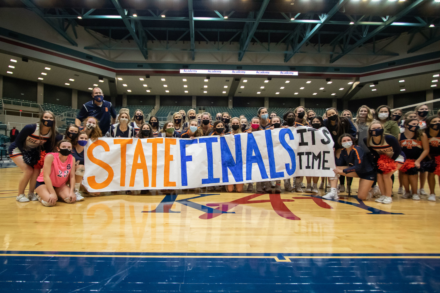 Seven Lakes players, coaches and supporters pose for a photo after the Spartans beat San Antonio Reagan, 3-2, in their Class 6A state semifinal on Dec. 7 at the Merrell Center.