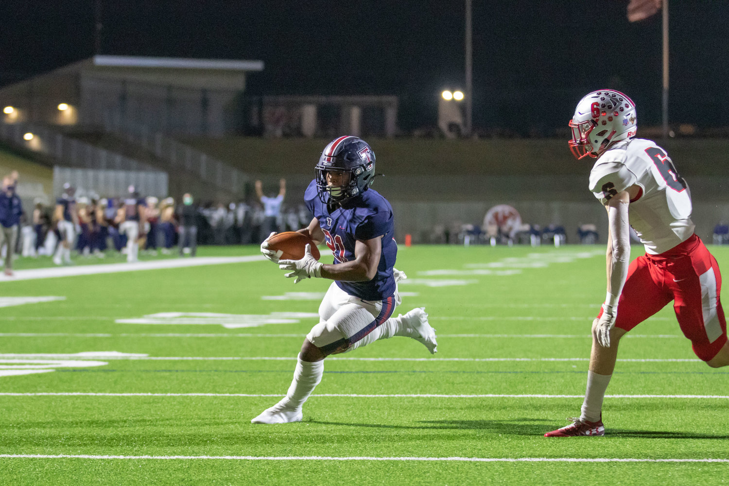 Tompkins senior running back Sherman Smith runs to score a touchdown during the Falcons' 42-10 Class 6A Division I bi-district playoff win over Fort Bend Travis on Dec. 11 at Legacy Stadium.