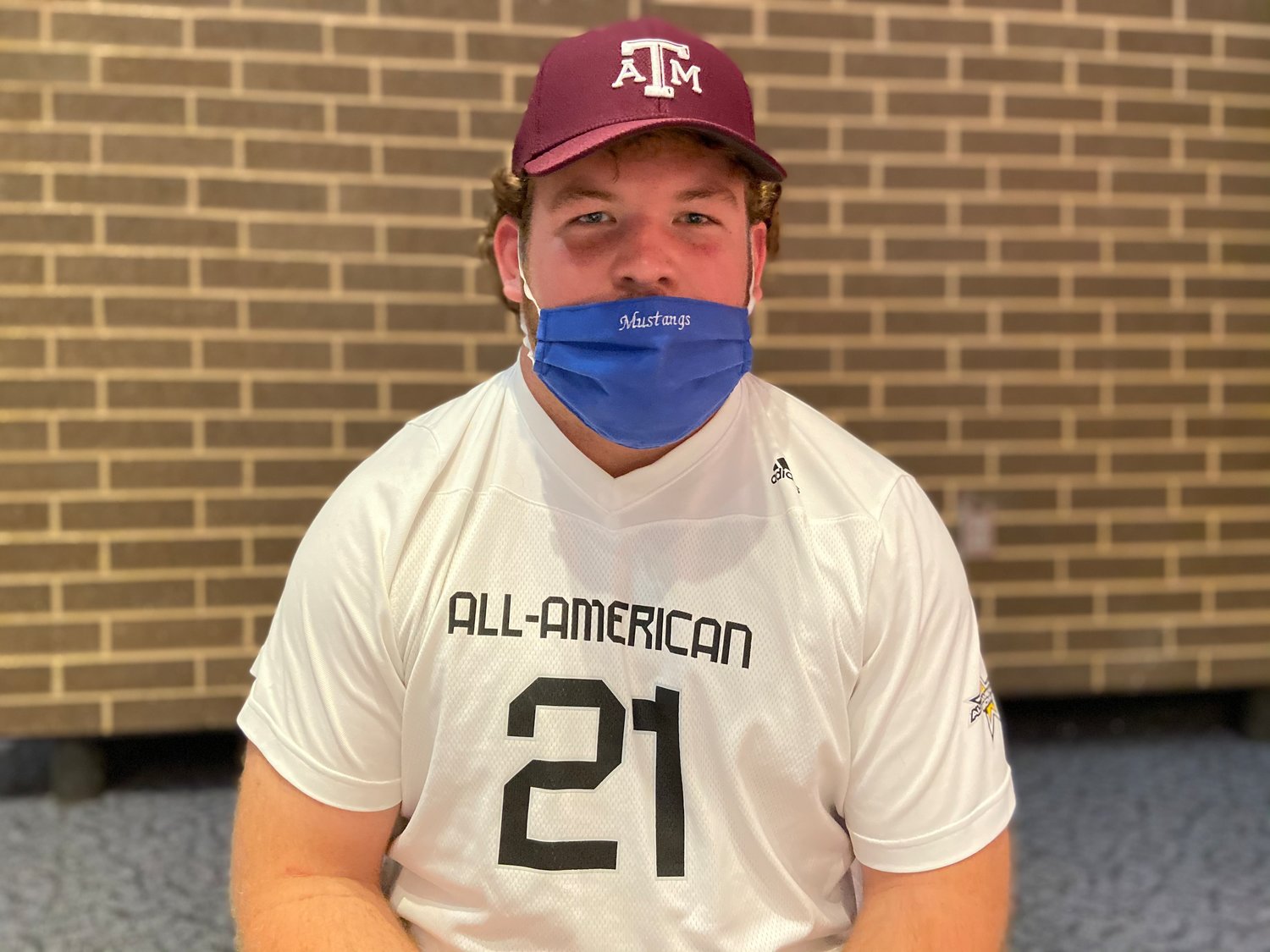 Taylor High senior offensive guard and Texas A&M signee Bryce Foster poses for a photo during a signing ceremony Friday at the performing arts center at Taylor High.
