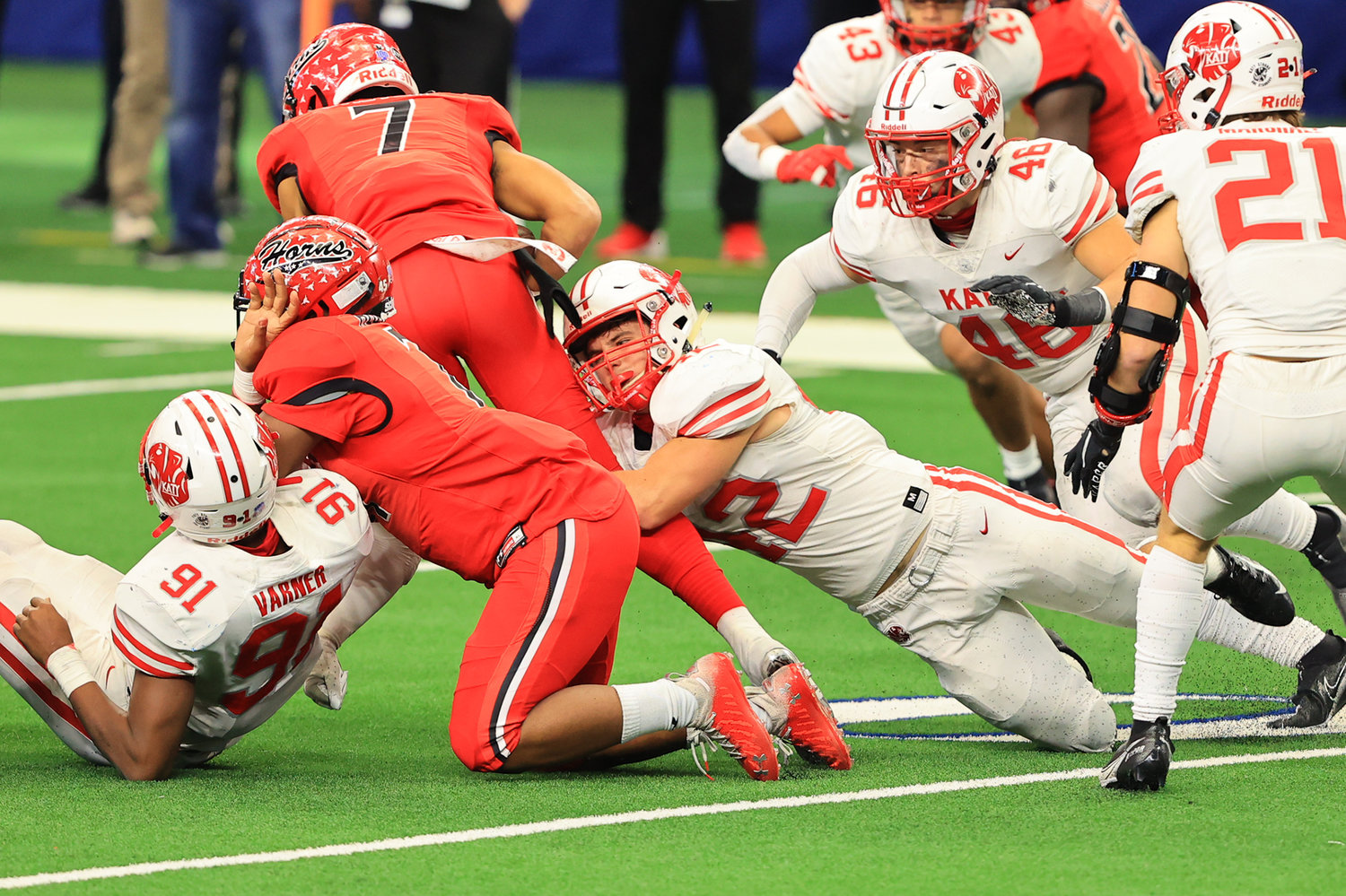 Katy junior linebacker Ty Kana (42) brings down Cedar Hill quarterback Kaidon Salter during the third quarter of the Tigers' 51-14 win over Cedar Hill at AT&T Stadium on Saturday afternoon. Katy won the Class 6A-Division II state championship.