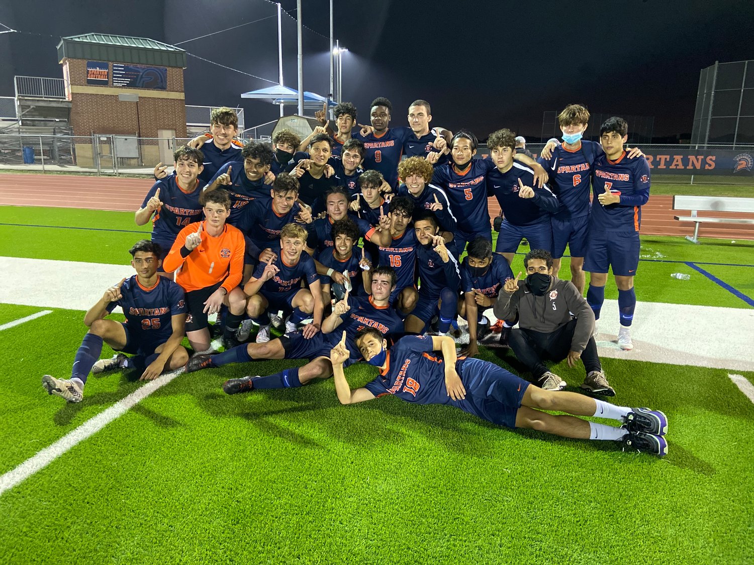 Seven Lakes players celebrate after their 2-1 win over Cinco Ranch on Friday, March 12, that secured the program's second straight district title and third in five years.