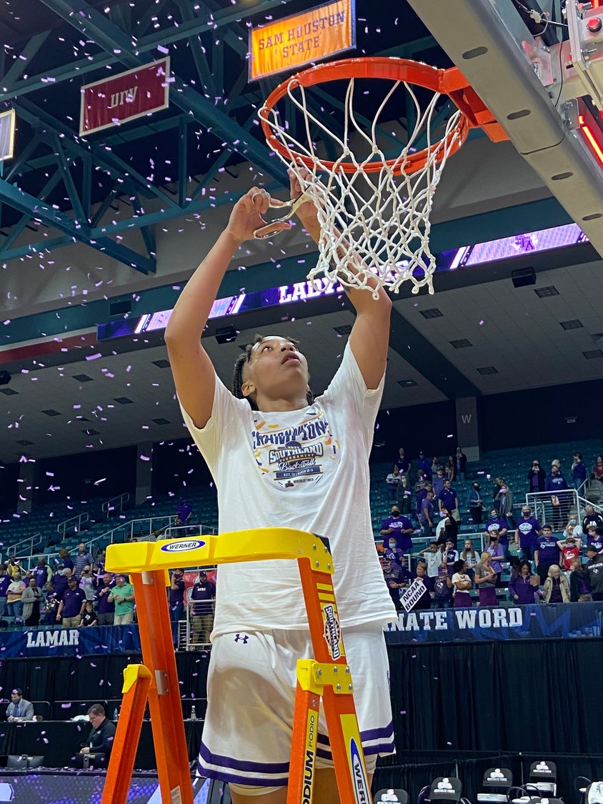Stephen F. Austin freshman forward Avery Brittingham cuts down a piece of the net in celebration after the Ladyjacks beat Sam Houston State, 56-45, in the Southland Conference Tournament women's basketball championship game Sunday, March 14, at the Merrell Center.