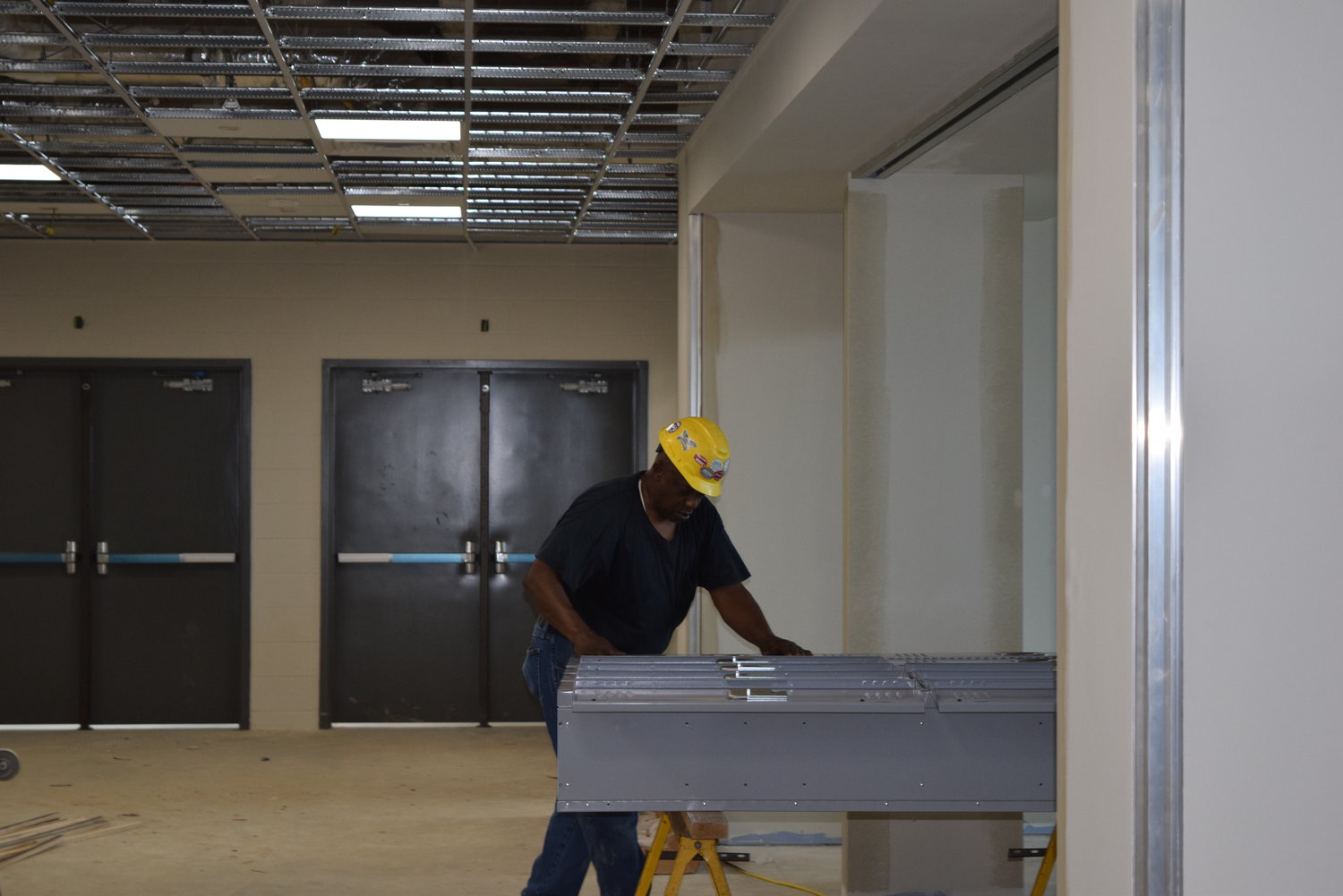 A worker assembles lockers at Katy ISD’s Haskett Junior High School Campus. The new school is expected to relieve pressure from growing student bodies at Katy and Stockdick junior high schools and will have an estimated first-year enrollment of about 800 students.