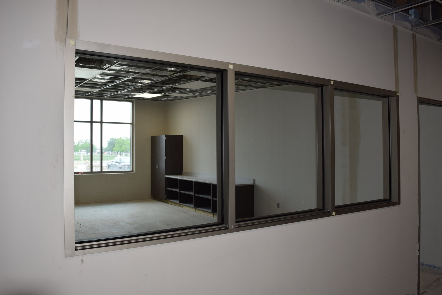 During normal operations, these windows will allow natural light to enter the hallways from outer classrooms at Haskett Junior High School. However, during an emergency the windows will be covered by sliding whiteboards which will keep intruders from looking inside the classrooms, thus improving safety for students.