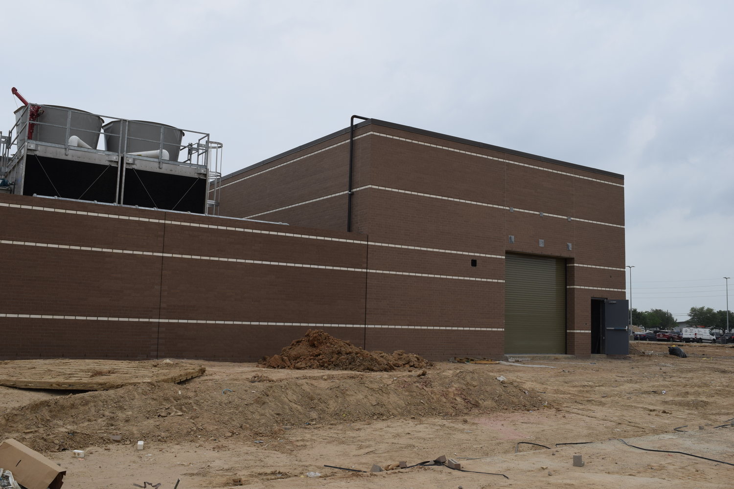 A garage door on the eastern side of the main building at Haskett Junior High provides ease of access to maintain HVAC equipment for the campus.