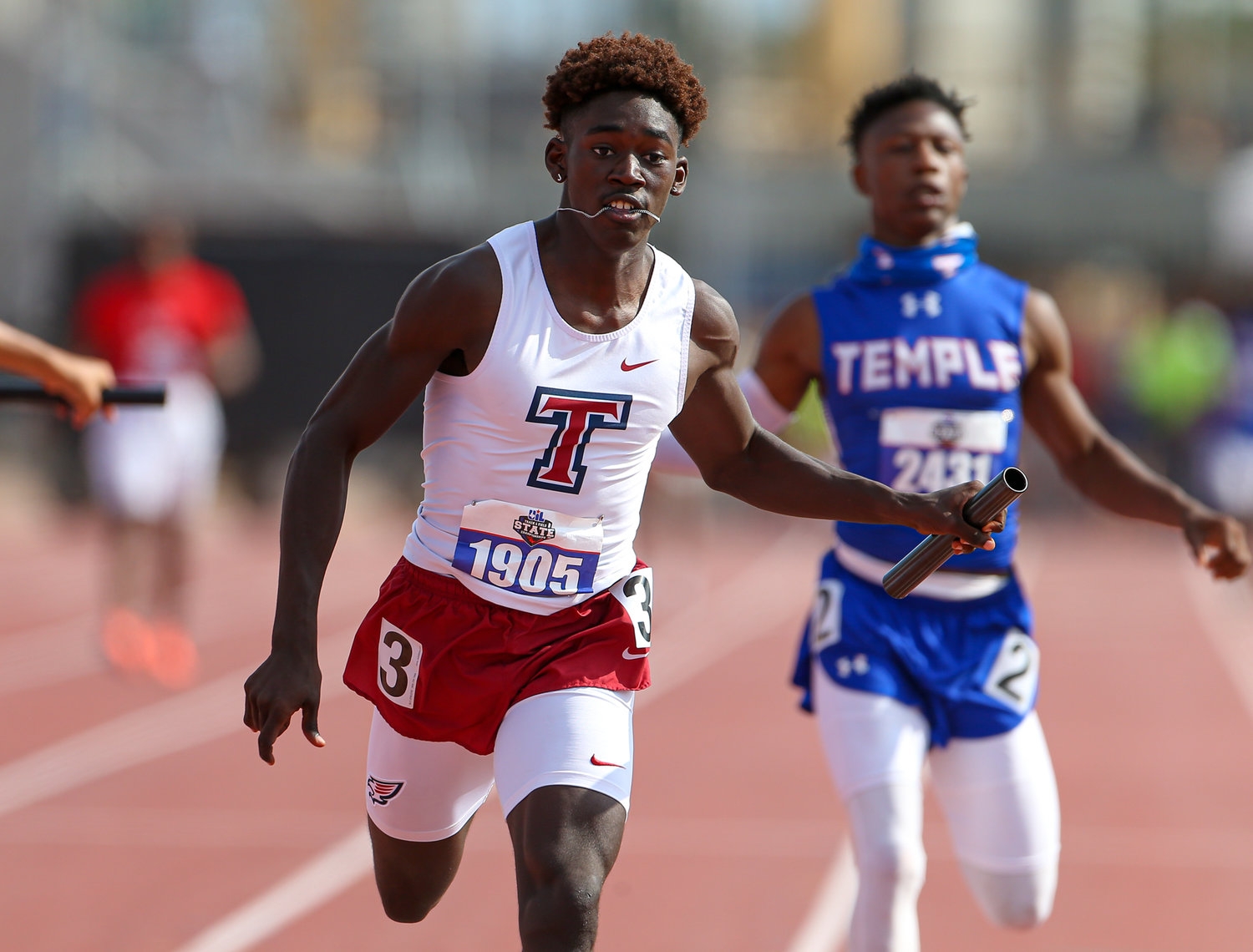 The Tompkins High School relay team competes in the Class 6A boys 4x100 meter relay event during the UIL State Track and Field Meet on May 8, 2021 at Mike A. Myers Stadium in Austin, Texas. The Tompkins team finished second in the event.