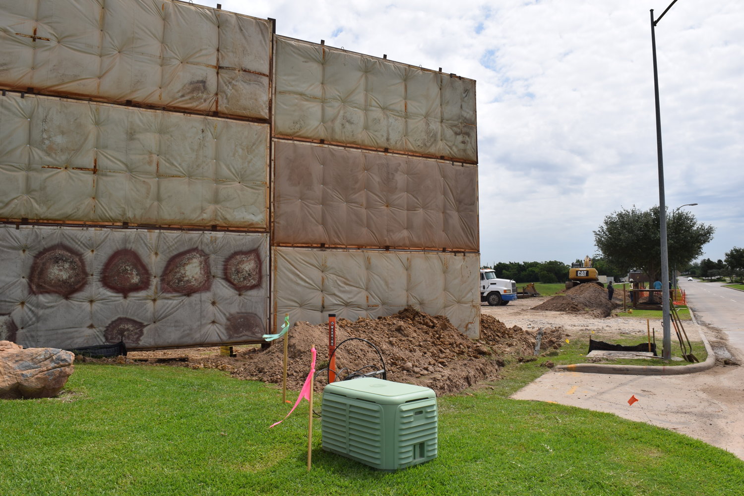Drilling of a new well for the city of Katy’s Water Plant No. 7 is causing noise disruptions for nearby residents despite the noise-buffering wall shown here being erected between the site and the nearby homes. This has caused problems for nearby homeowners working from home during the pandemic over the last year.