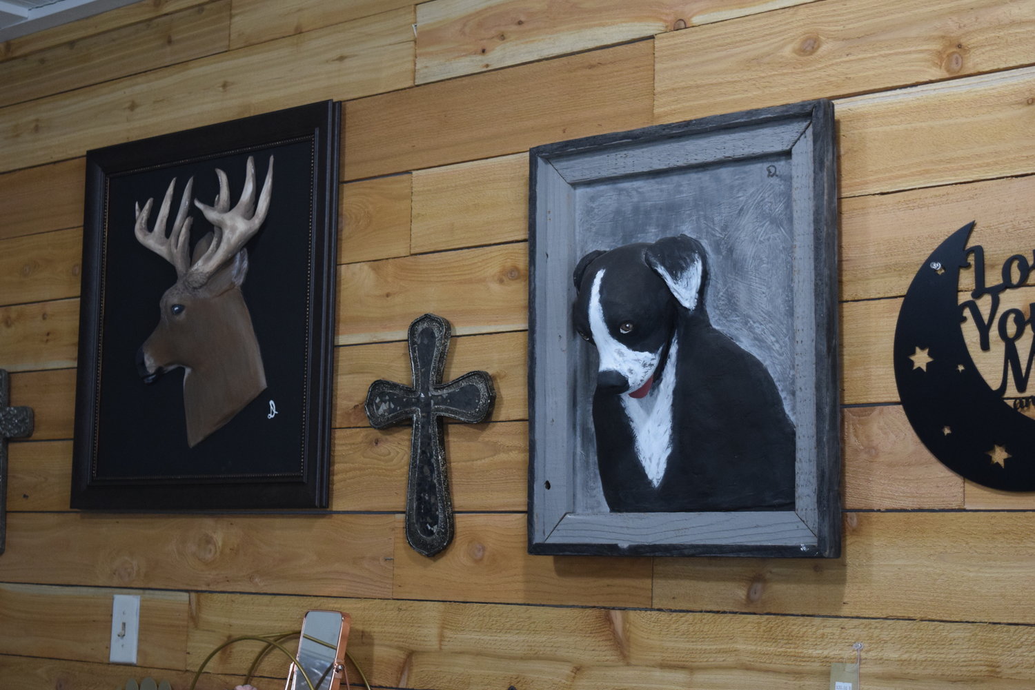 Three-dimensional paintings like these dog and deer paintings are part sculpture, part painting.