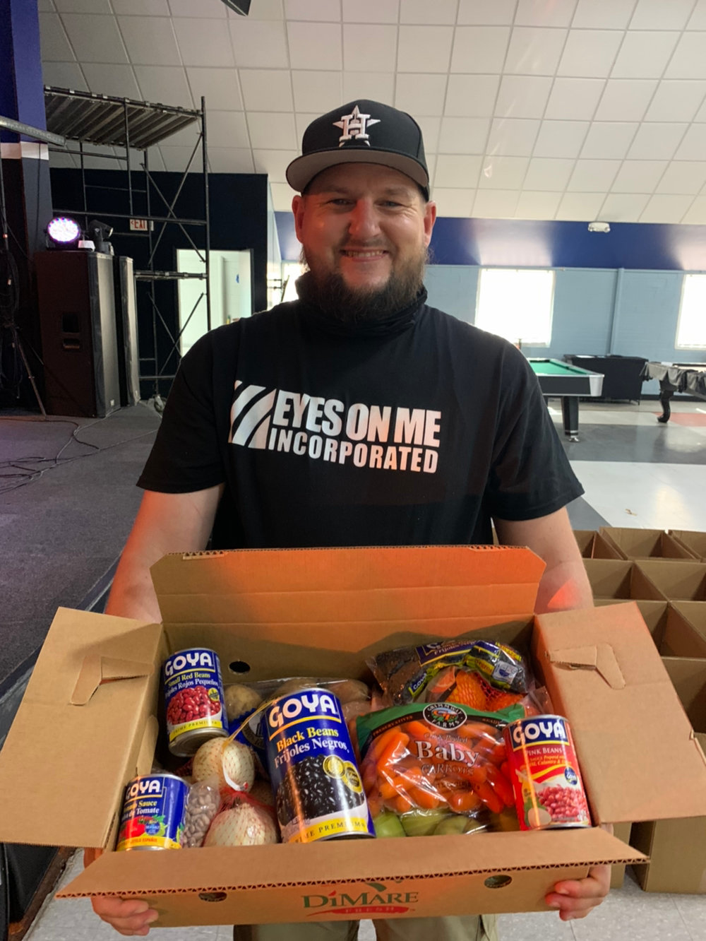 Ryan Orbin helps distribute food at one of the recent events hosted by The Hanger Unity Community Center. Orbin helped cofound the facility after finding his faith in rehab and connecting to Houston-area Christian rapper Bobby Herring, also known as Tre9.
