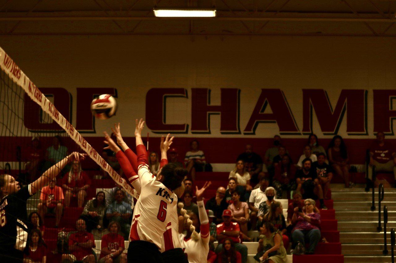 A number of Katy High players go up for a block attempt against Fort Bend Austin during Tuesday’s match at the Katy High gym.