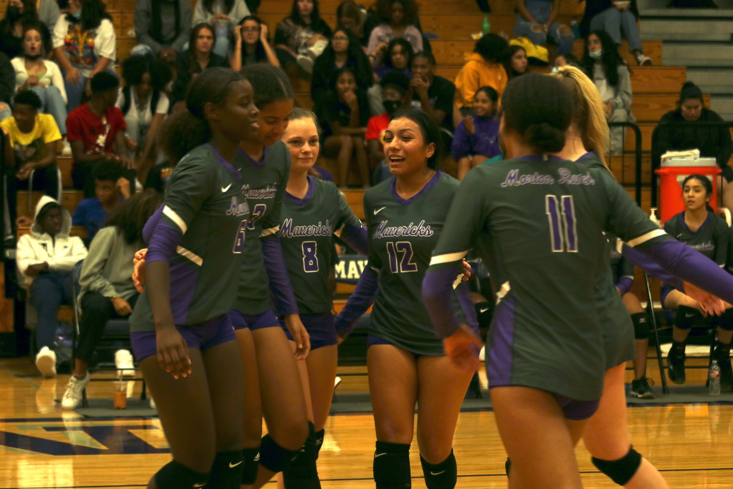 Morton Ranch celebrates a point during the teams sweep of Royal on Tuesday at the Morton Ranch gym.