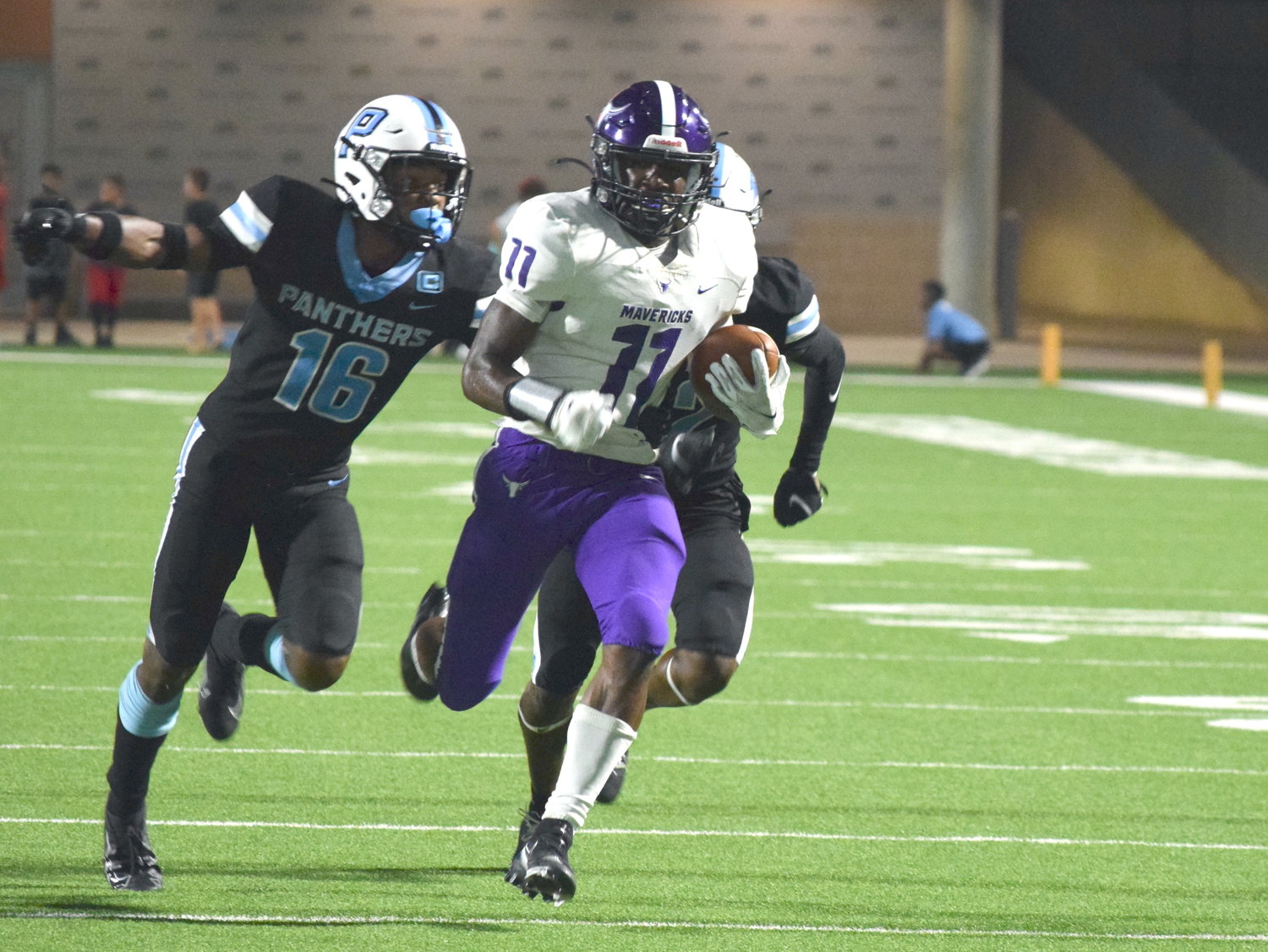Morton Ranch’s Josiah Mills tries to break away from the Paetow defense during a game at Legacy Stadium on Sept. 3.