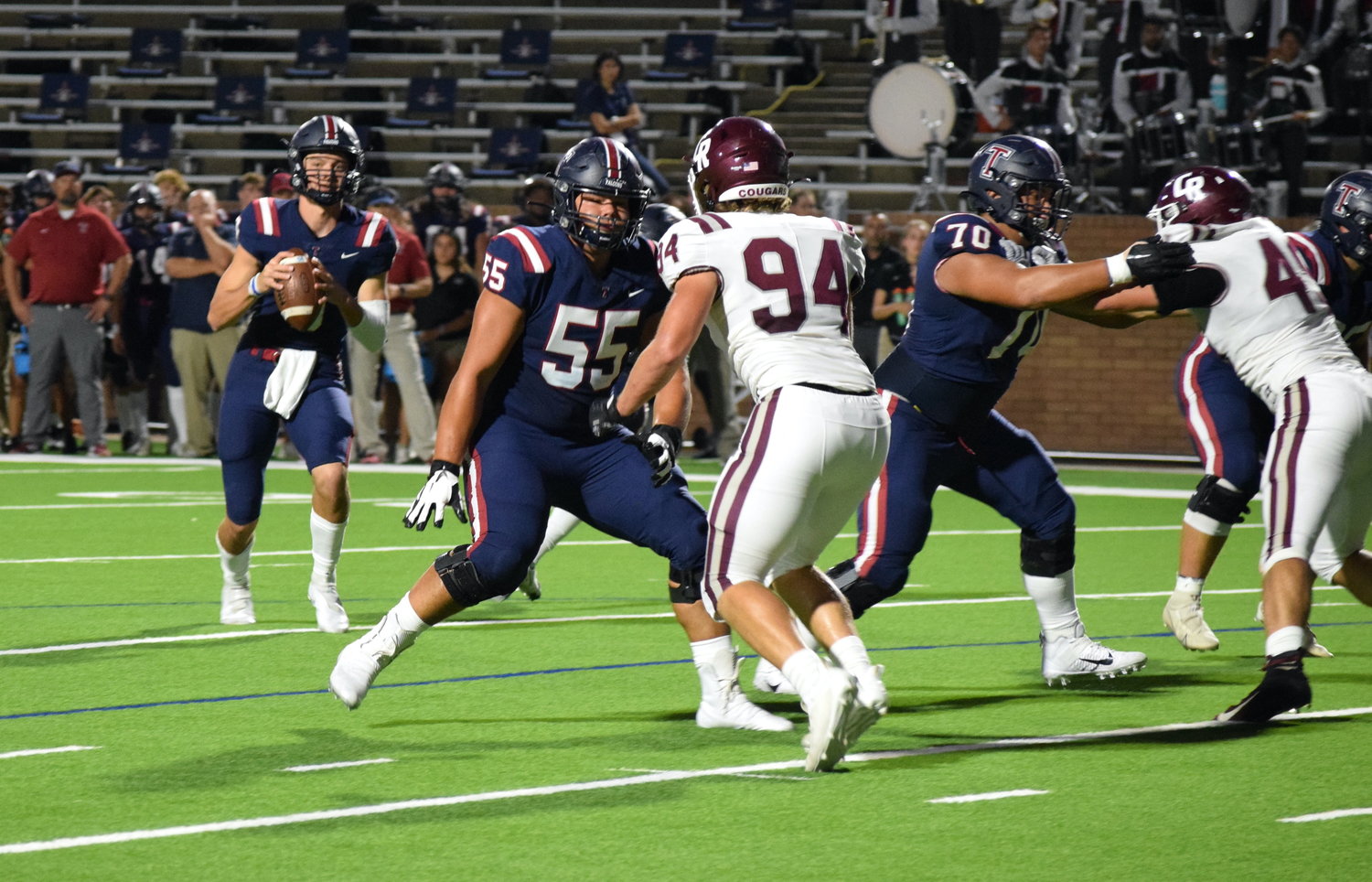 Cole Franis pump fakes before throwing the ball during a game against Cinco Ranch at Rhodes Stadium on Thursday.