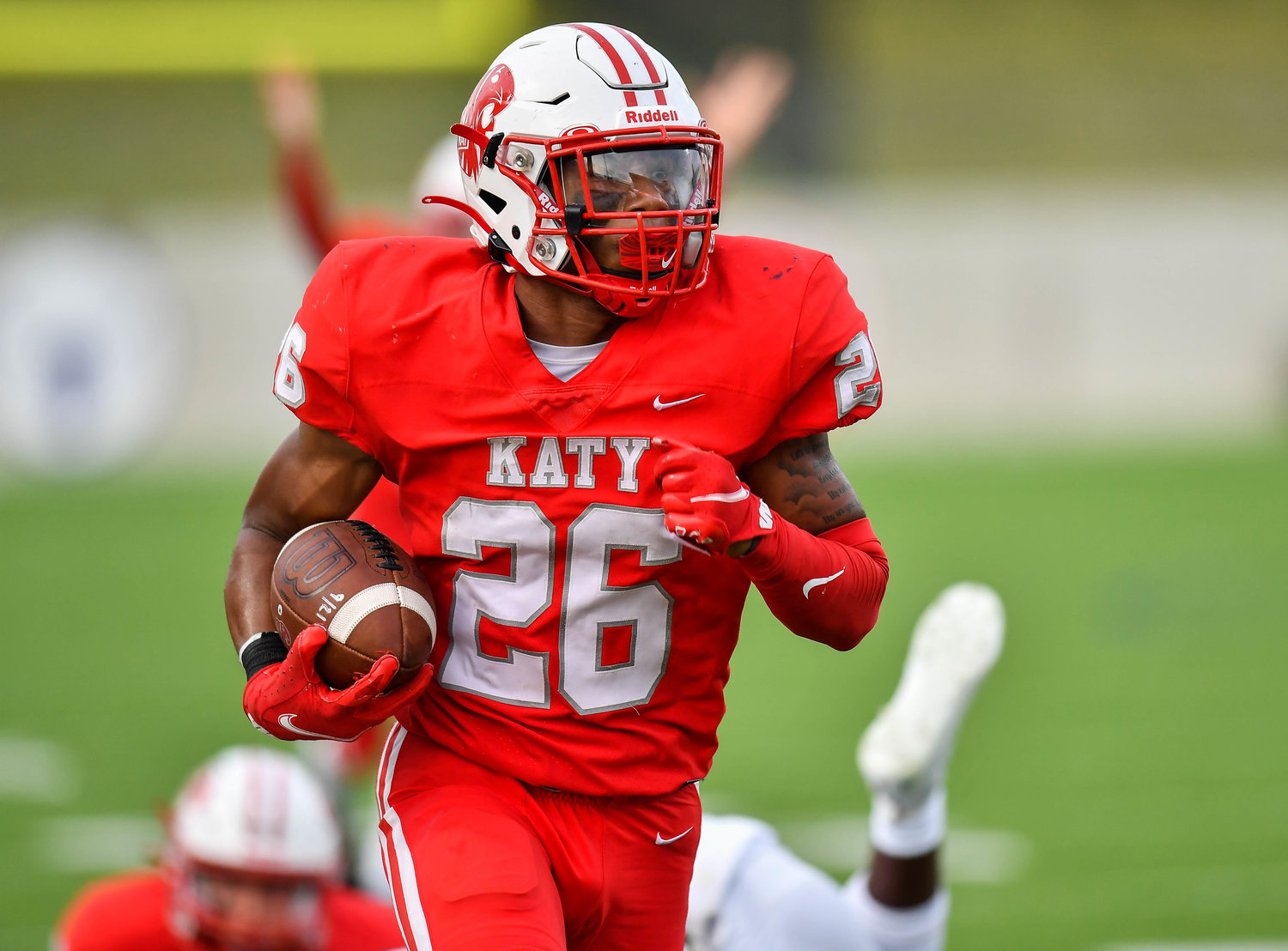 Katy, Tx. Oct. 1, 2021: Katy's #26 Isaiah Smith carries the ball scoring a TD during a game between Katy Tigers and Tompkins Falcons at Legacy Stadium in Katy. (Photo by Mark Goodman / Katy Times)