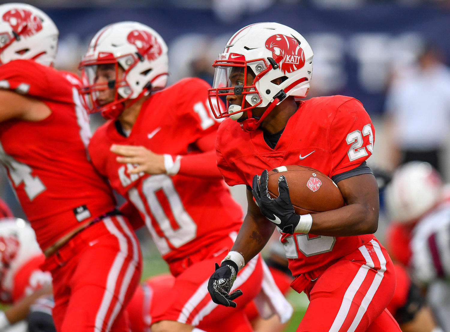 Katy, Tx. Oct 1, 2021: Katy's #23 Seth Davis carries the ball from mid field scoring a TD during a game between Katy Tigers and Tompkins Falcons at Legacy Stadium in Katy. (Photo by Mark Goodman / Katy Times)