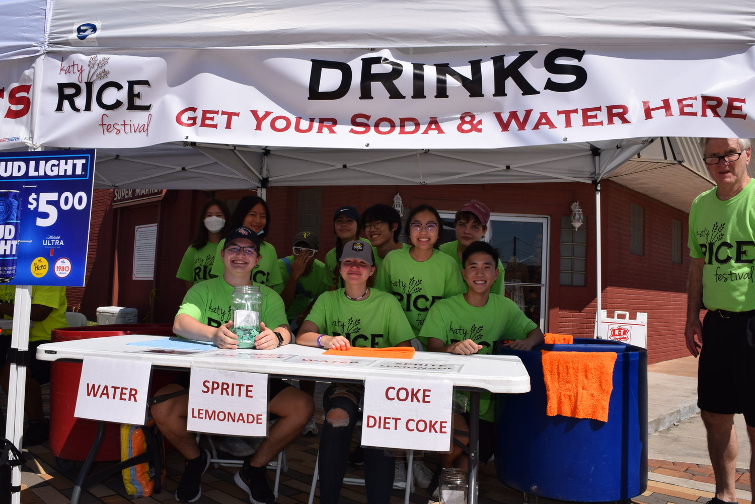 Former Katy Mayor Skip Conner (far right) helps volunteers at a drink tent. The Katy Rice Festival is mostly run by volunteers with the help of city staff and consultants to ensure everything stays on track. Over the last few years, the neon shirts worn by festival volunteers have become somewhat iconic.