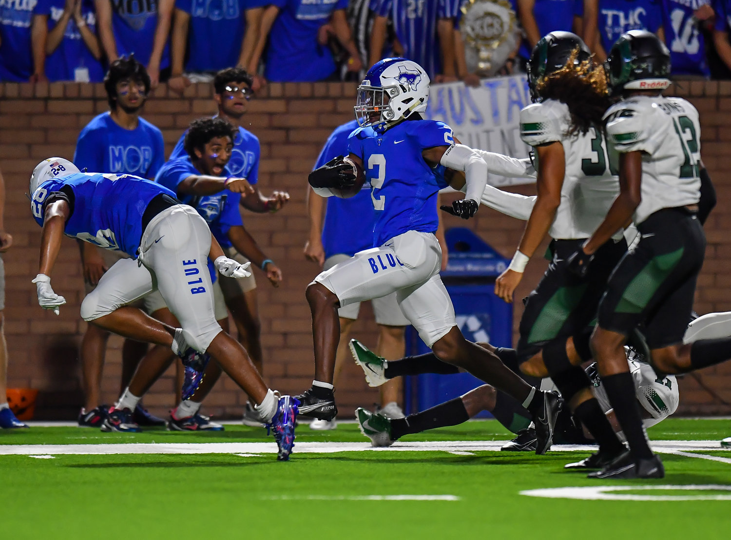 Katy, Tx. Oct 15, 2021:  Katy Taylors Michael Whitaker iii #2 rushes to the out side for a first down during a conference game between Mayde Creek and Katy Taylor at Rhodes Stadium. (Photo by Mark Goodman / Katy Times)