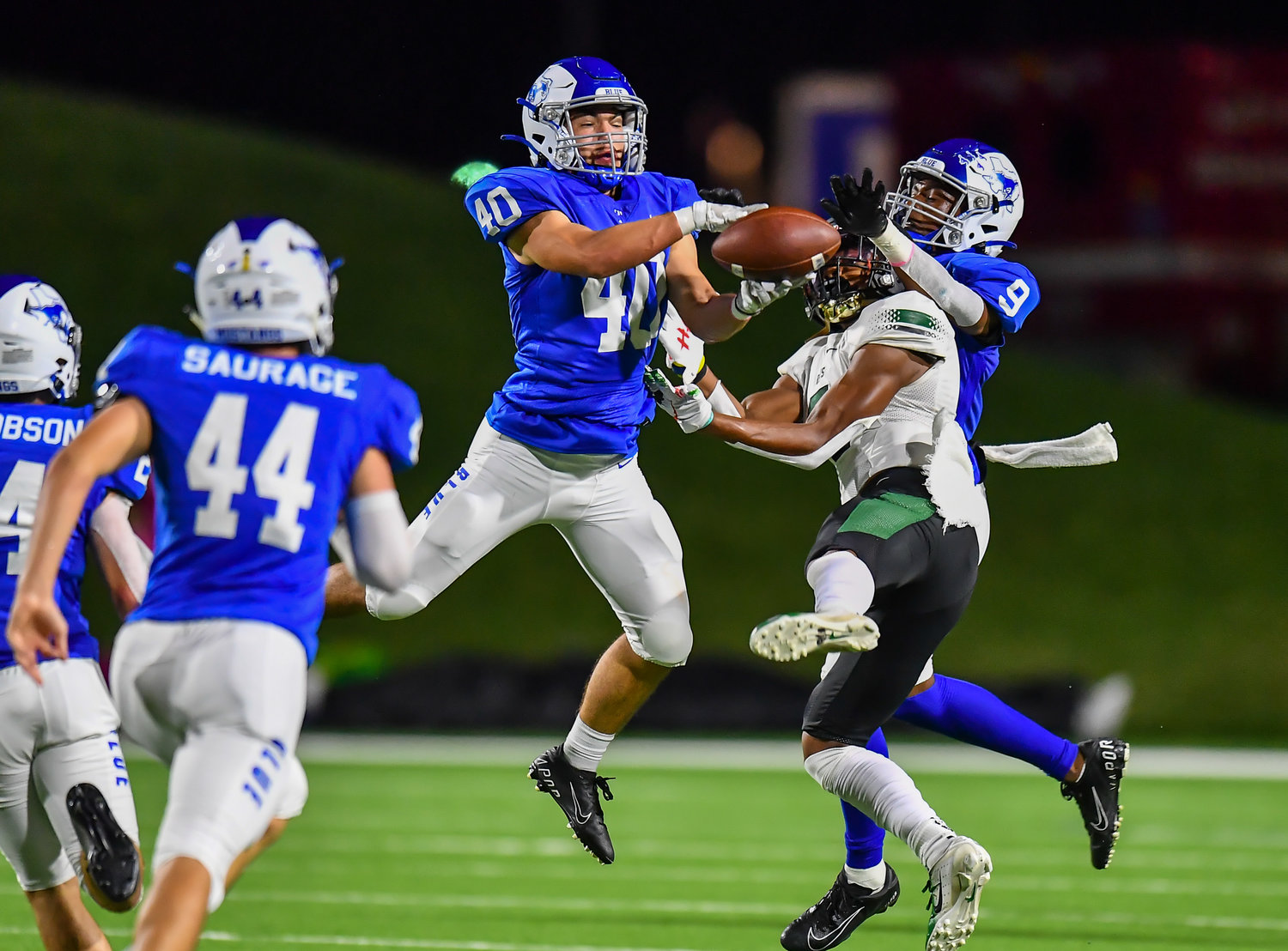 Katy, Tx. Oct. 15, 2021: Katy Taylors Jase Forester #40 intercepts the pass intended for Mayde Creeks Jordan Kelly #5 during a conference game between Mayde Creek and Katy Taylor at Rhodes Stadium. (Photo by Mark Goodman / Katy Times)