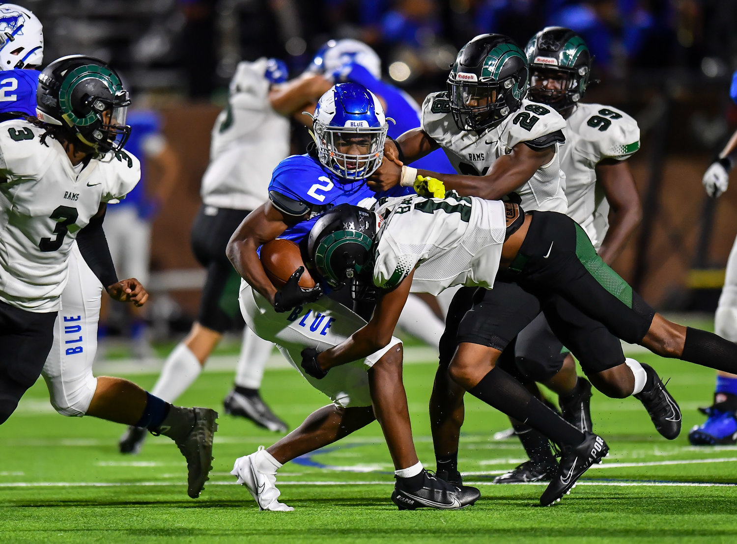 Katy, Tx. Oct 15, 2021:  Katy Taylors Michael Whitaker iii #2  rushes for a first down before being brought down by Ram defenders during a conference game between Mayde Creek and Katy Taylor at Rhodes Stadium. (Photo by Mark Goodman / Katy Times)