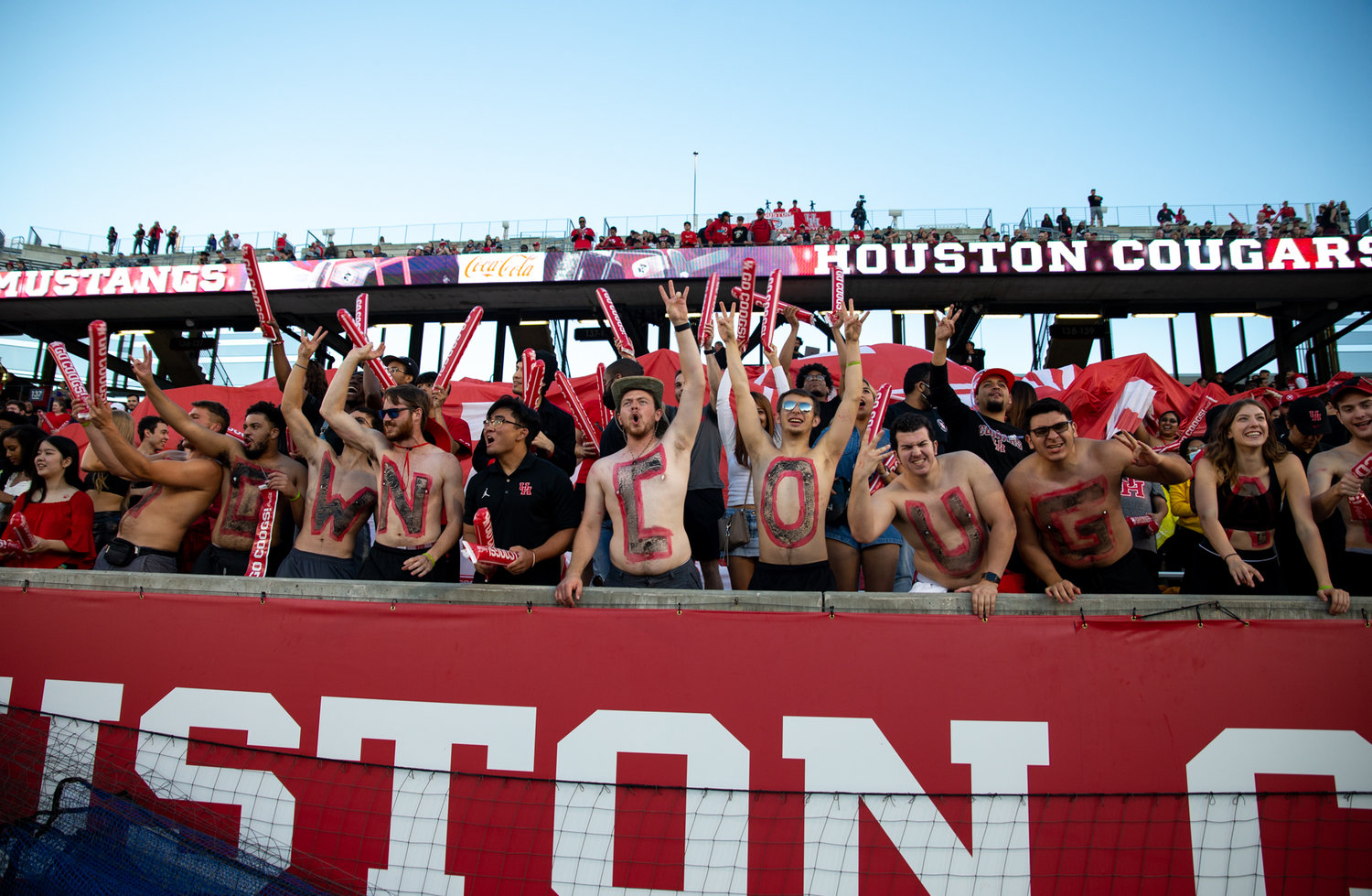 Houston Cougars students cheer during an NCAA football game between Houston and SMU on October 30, 2021 in Houston, Texas.