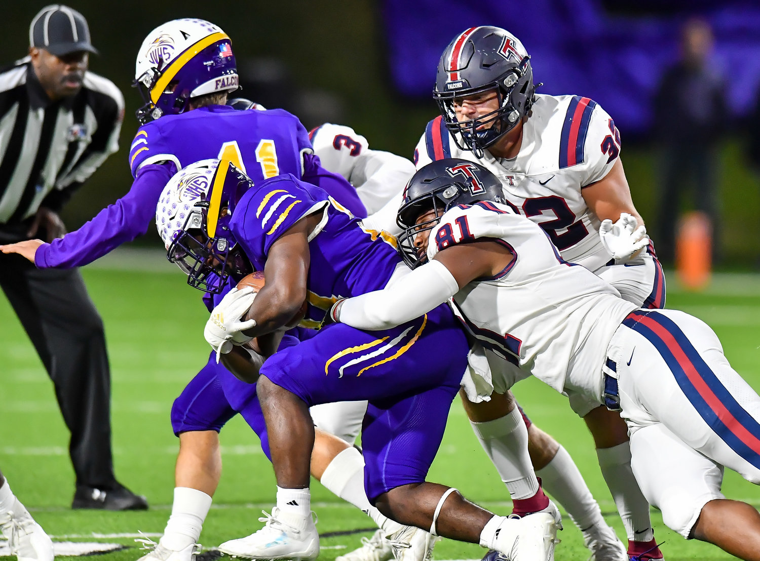 Houston Tx. Nov 19, 2021: Tompkins #81 Sean Dubose, jr makes the stop on Jersey Village, Rashon Estes #24 during the UIL area playoff game between Tompkins and Jersey Village at Pridgeon Stadium in Houston. (Photo by Mark Goodman / Katy Times)