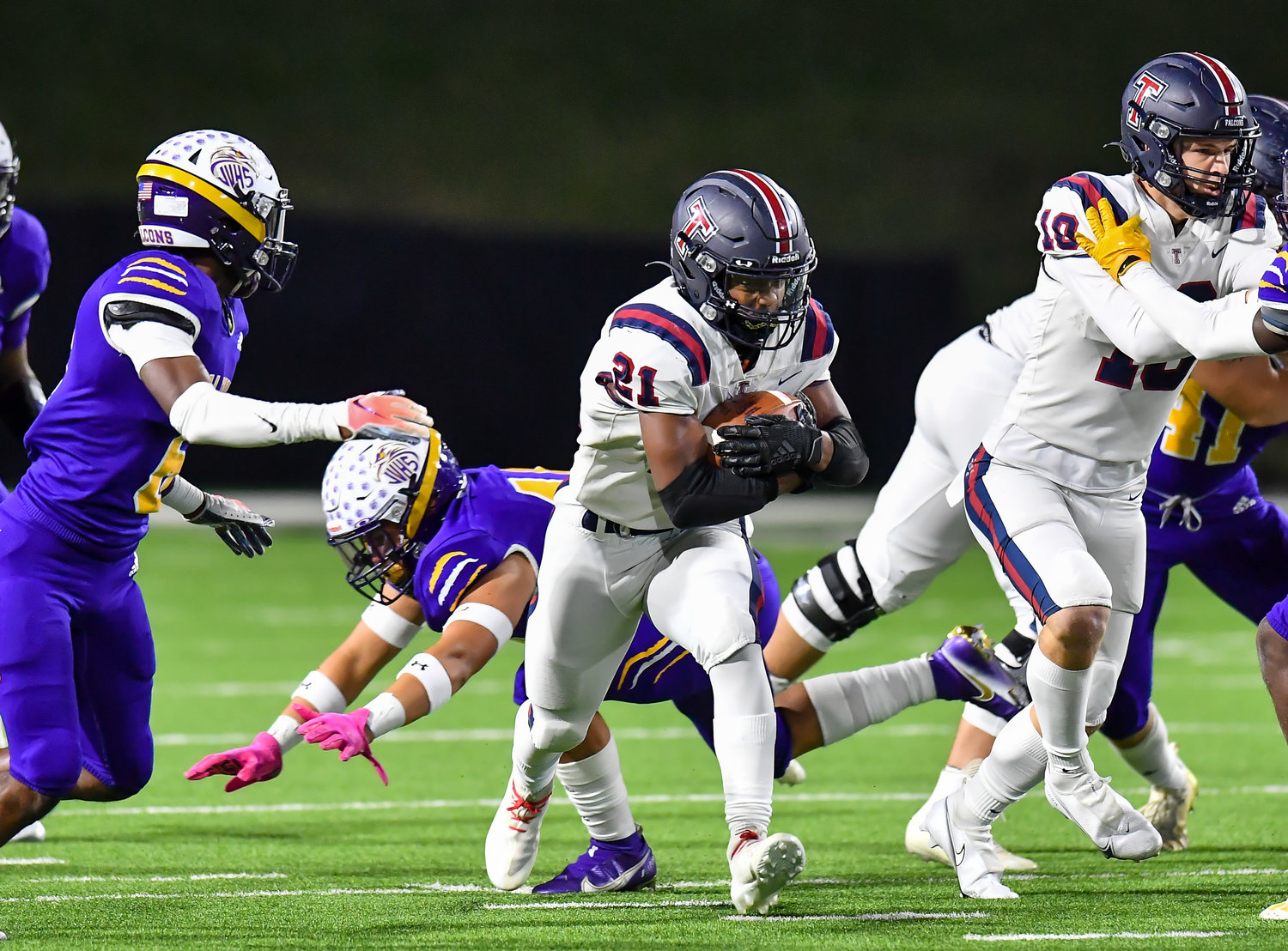 Houston Tx. Nov 19, 2021: Tompkins #21 Caleb Blocker rushes up the middle during the UIL area playoff game between Tompkins and Jersey Village at Pridgeon Stadium in Houston. (Photo by Mark Goodman / Katy Times)