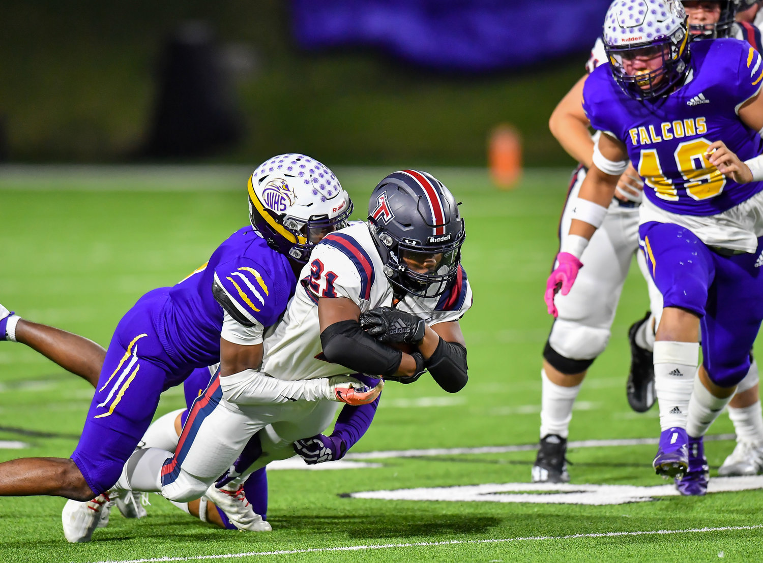 Houston Tx. Nov 19, 2021: Tompkins #21 Caleb Blocker rushes up the middle for a first down during first half of the UIL area playoff game between Tompkins and Jersey Village at Pridgeon Stadium in Houston. (Photo by Mark Goodman / Katy Times)